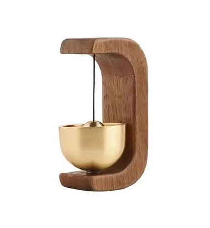 Decorative item with a gold bowl and wooden holder on a white background